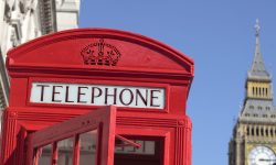 Senior couple with red telephone box in London